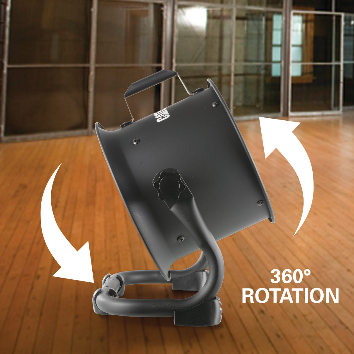 A dark gray industrial fan or blower shown on a wooden floor in an indoor room, with white arrows indicating rotation and the text '360° ROTATION' overlaid on the image.