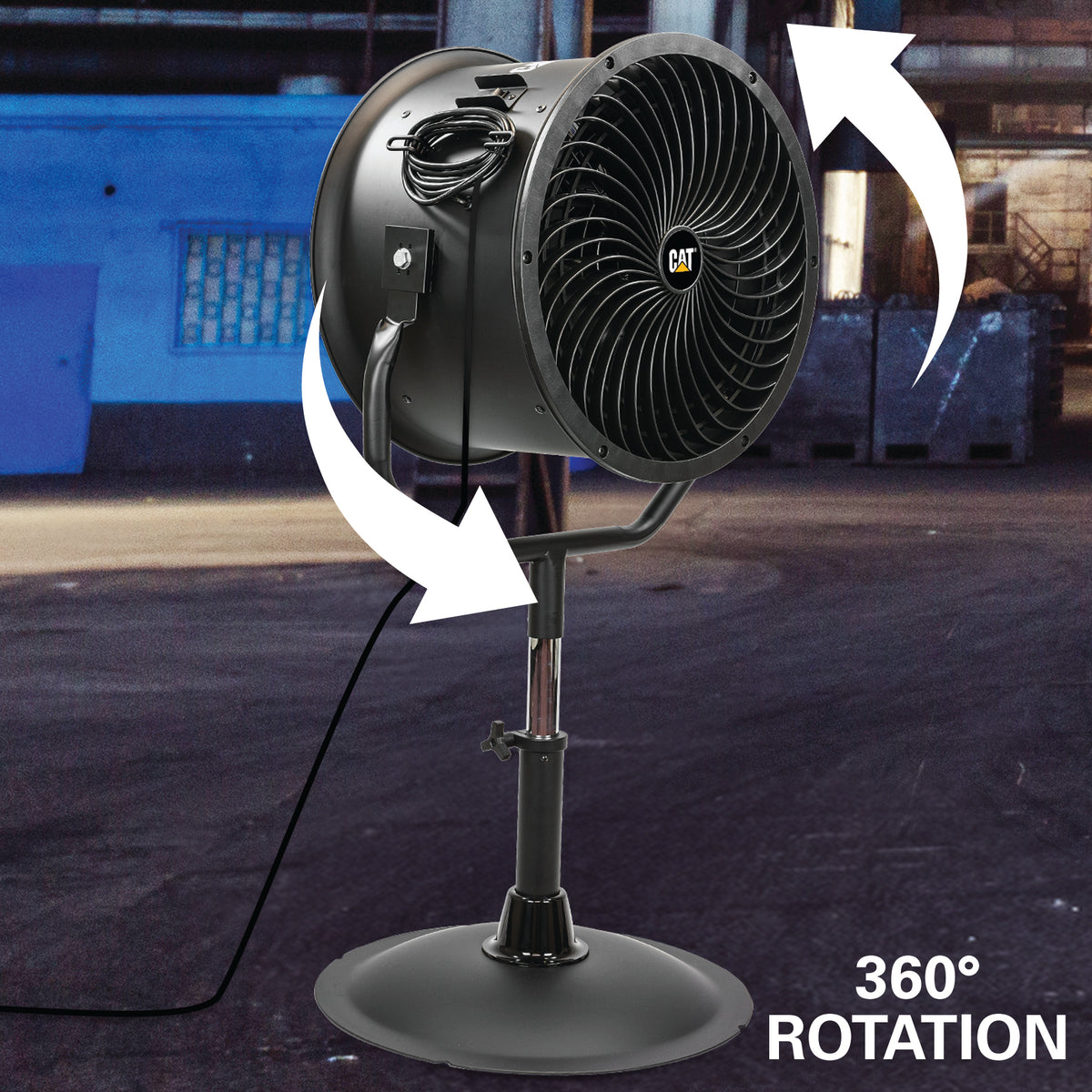 A black CAT industrial pedestal fan with white arrows showing 360° rotation, set against an industrial warehouse background.