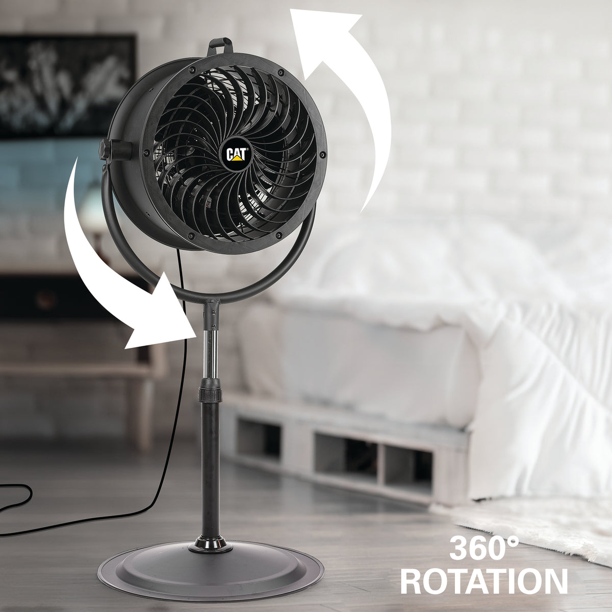 A CAT industrial pedestal fan shown in a bedroom setting with white bedding in the background. White arrows illustrate 360-degree rotation, and the text '360° ROTATION' is visible in the lower right corner.